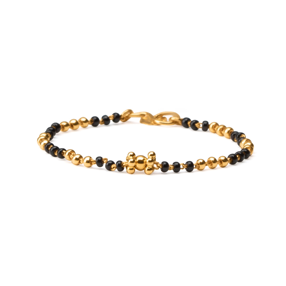 baby gold bracelet with black beads