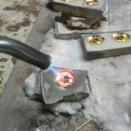 Soldering individual motifs to create a Rosette element Soldering individual motifs to create a Rosette element