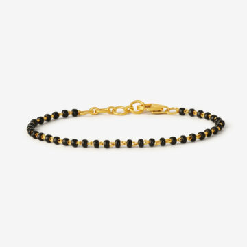 Schwarzes Kinderarmband mit goldenen Perlen